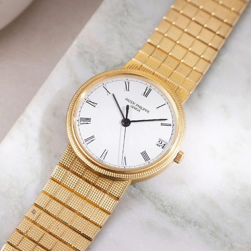 Patek Philippe Calatrava Automatic White Dial in 18k Yellow Gold Ref. 3802J with Integrated Bracelet